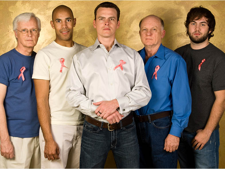 men wearing breast cancer ribbons