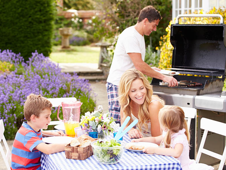family outside, grill, picnic, eating, grills, hotdog, children, mom, dad