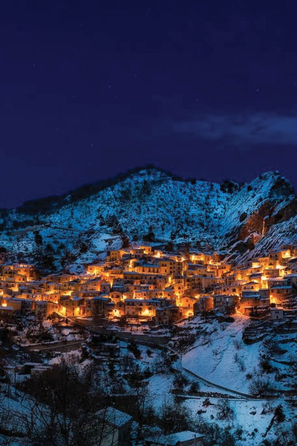 town nestled along a snowy mountainside