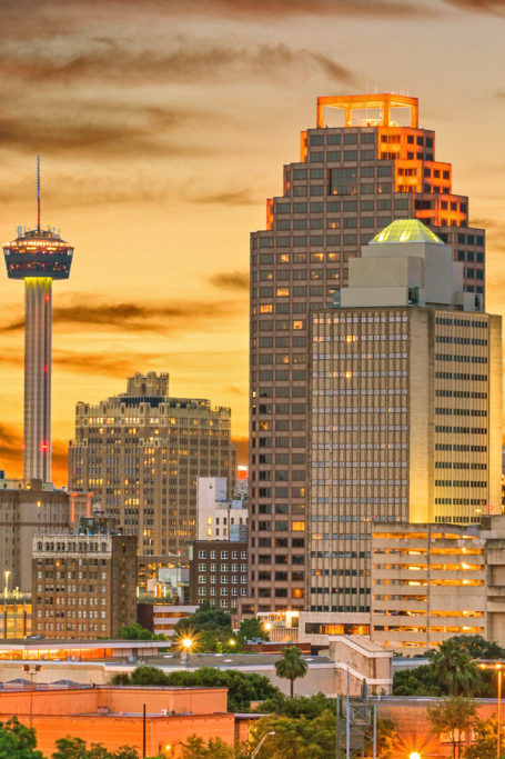 City skyline with sunset background