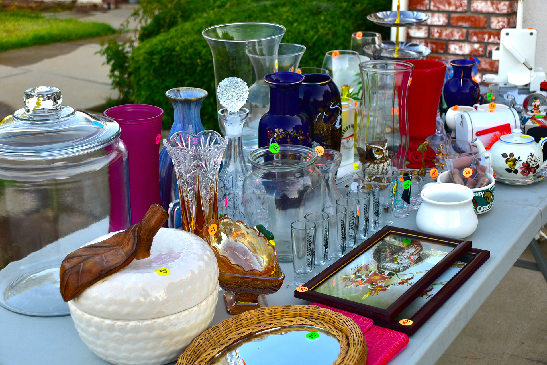 Garage sale with items priced and displayed on a table