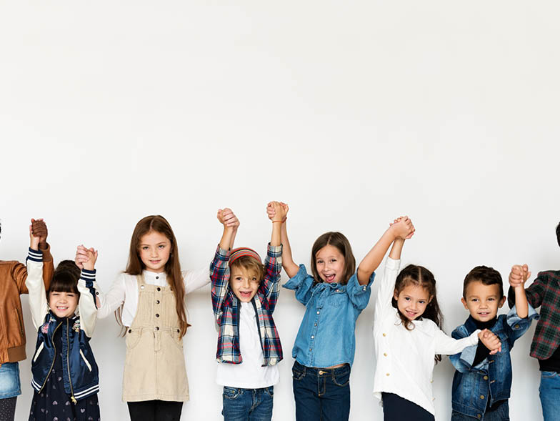 children holding up arms
