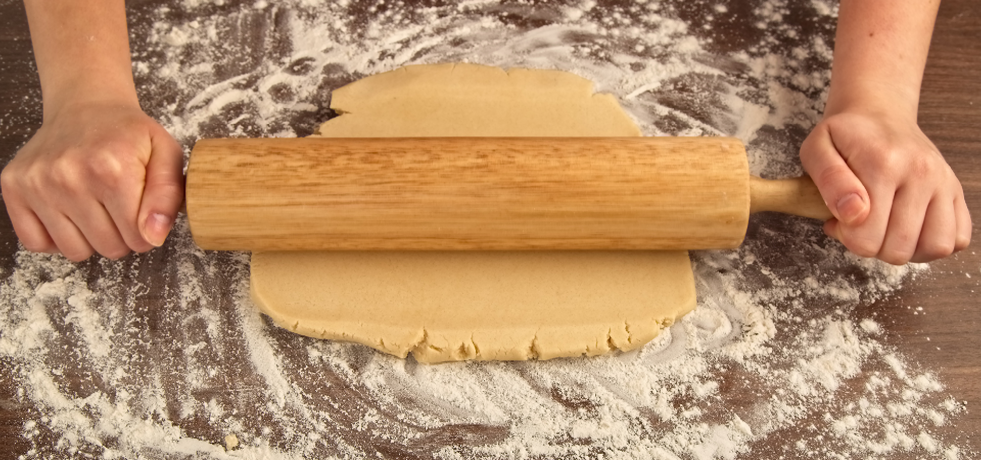 Flattening dough with a rolling pin