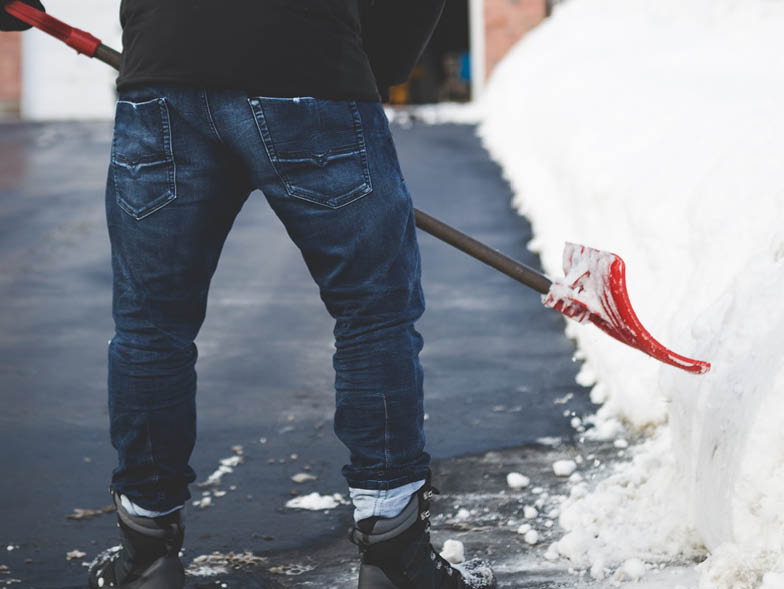man shoveling snow alt