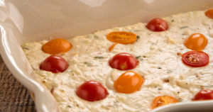Mediterranean herb and cheese dip with cherry tomatoes