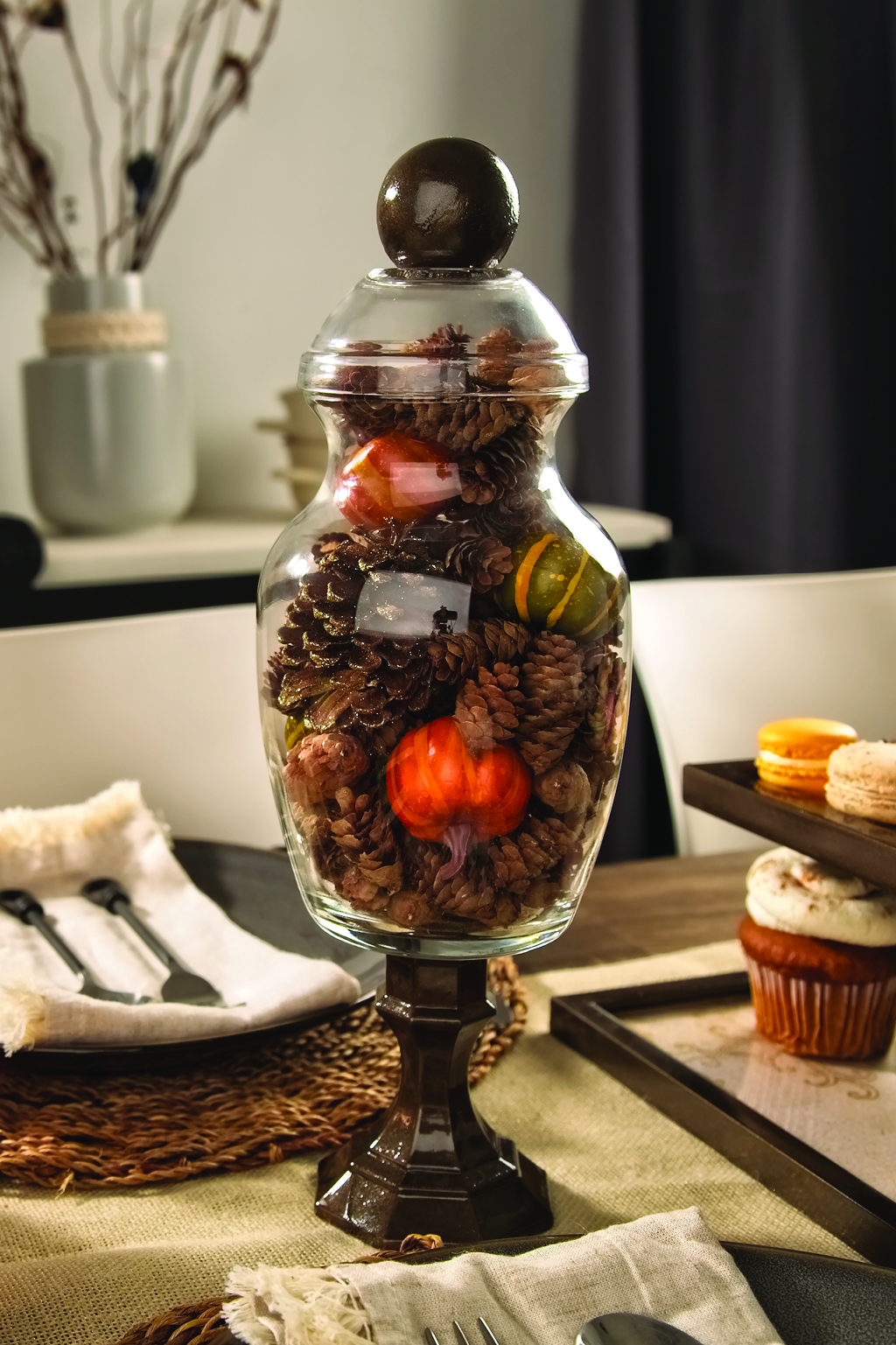 Glass apothecary jar filled with fall accents