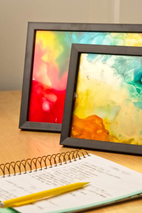 Framed ink burning art and notepad with pencil