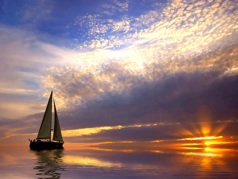sailboat on calm water, sunset