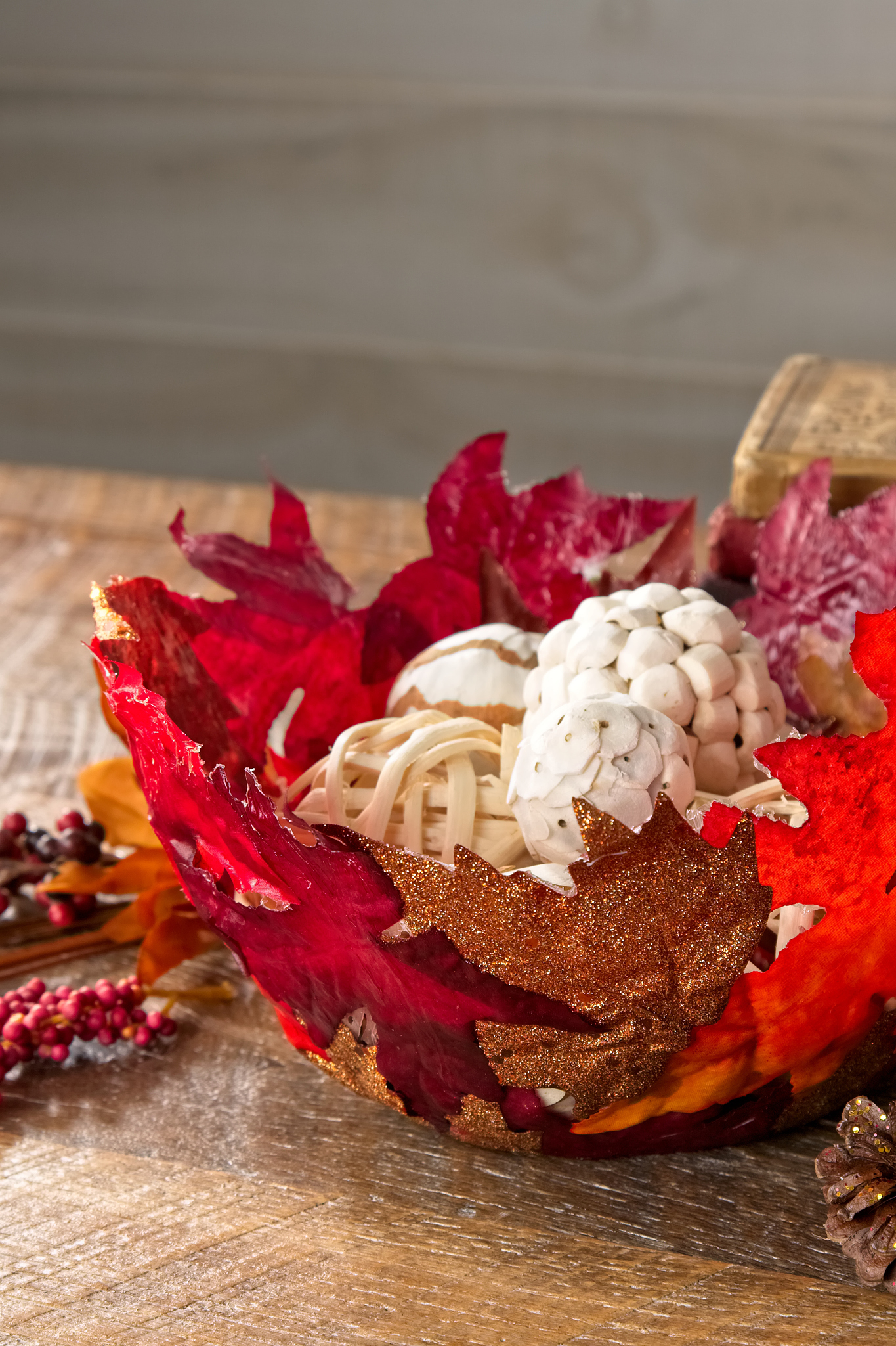 Colorful leaf bowl with white accessories inside