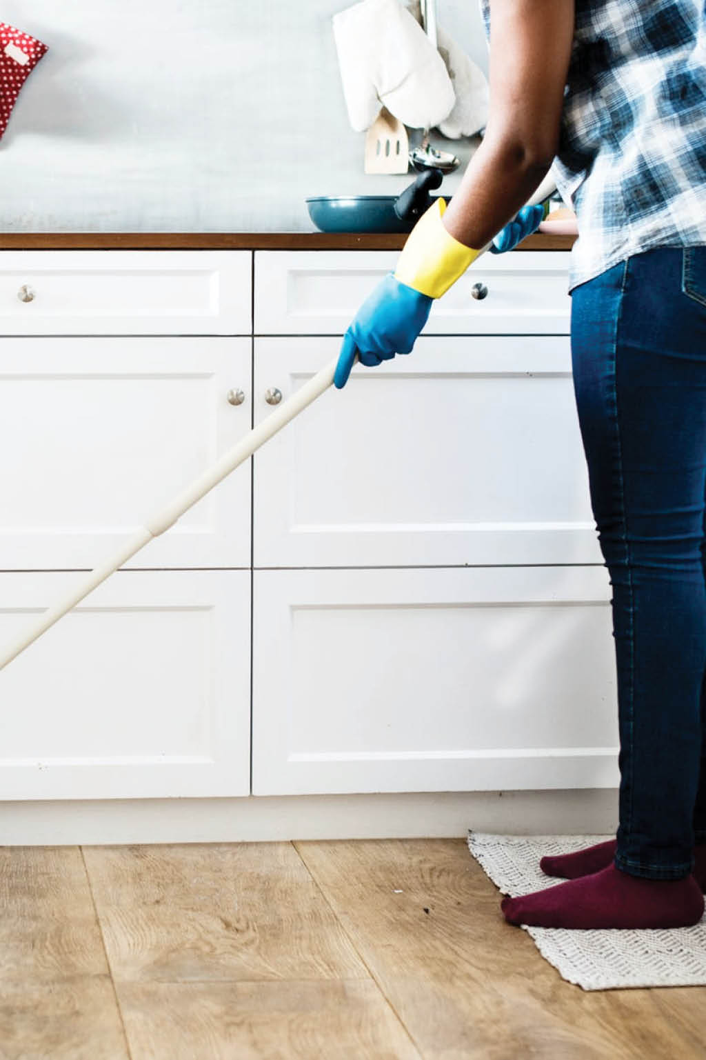 woman mopping kitchen floor