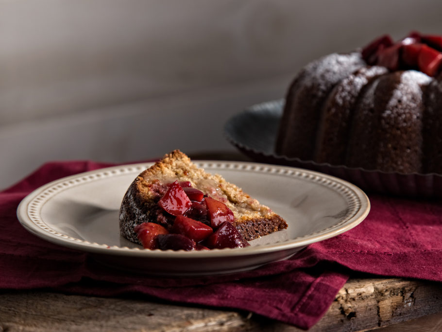 Slice of rye pound cake with plum compote