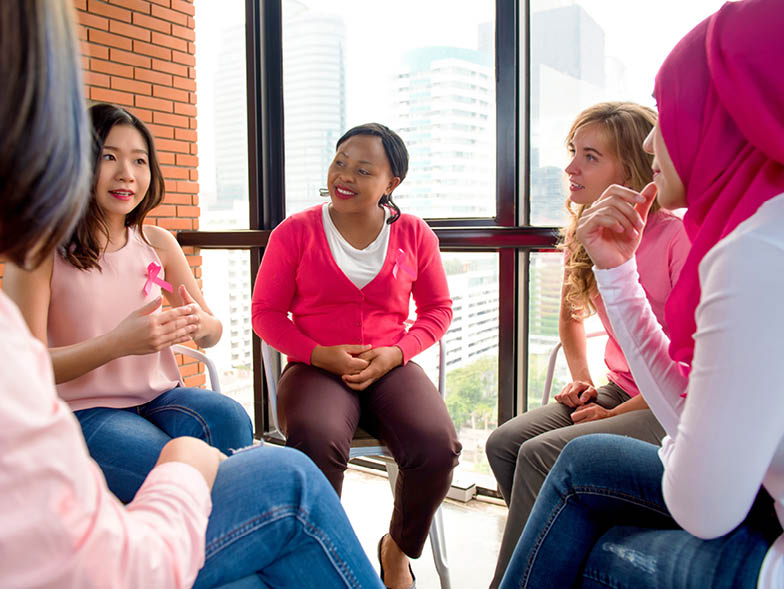 woman in pink group meeting