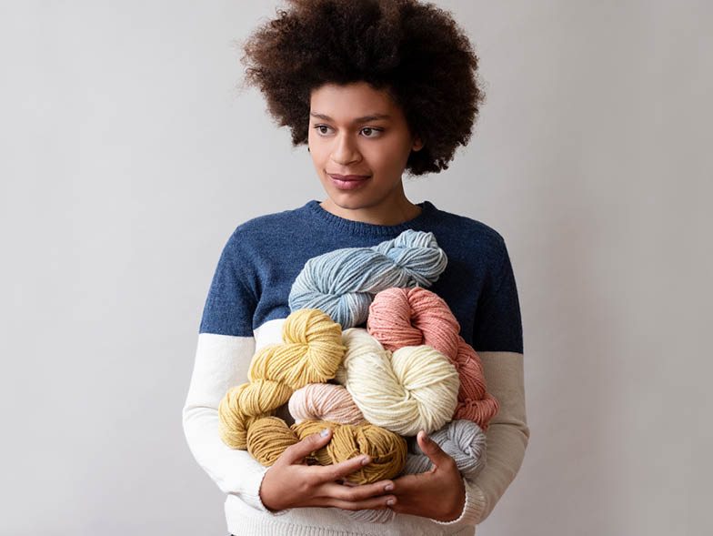 woman holding wool