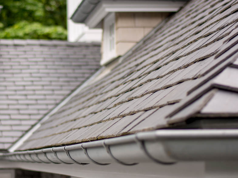 Closeup view of gutters on house