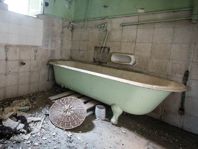 Damaged and disheveled bathroom