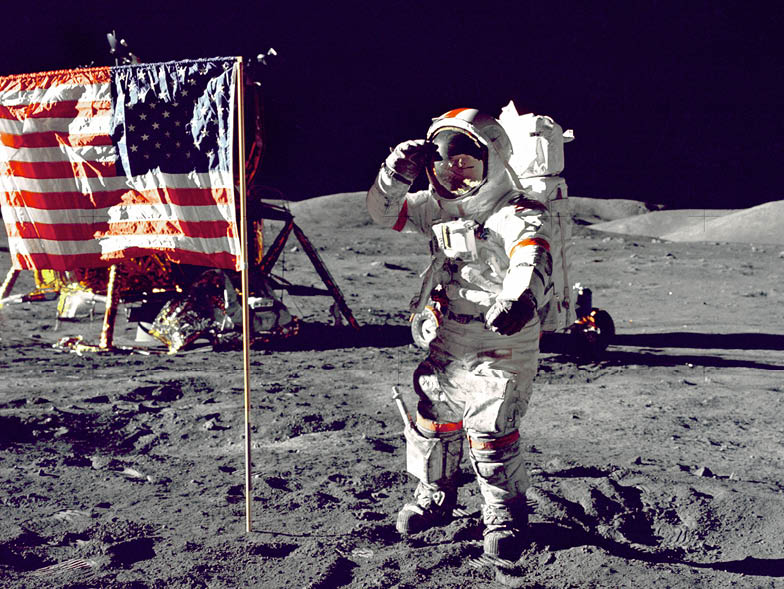 Astronaut next to American flag