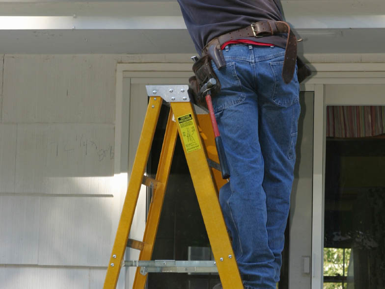 Maintenance man on ladder