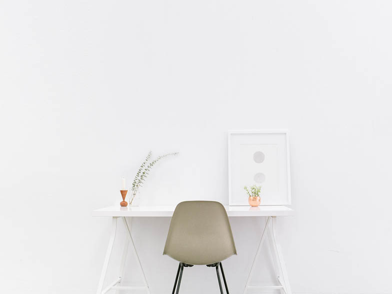 White desk against white wall