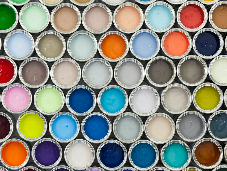 top view of open paint cans with various colors