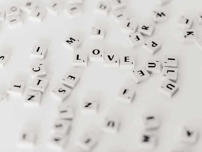 Scrabble letters scattered on table