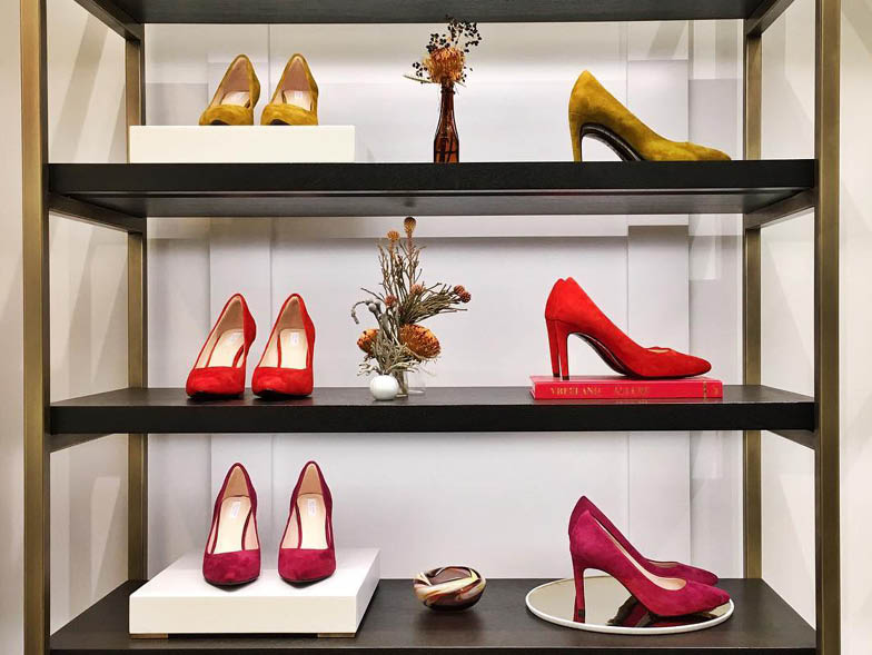 High heel shoes displayed on shelving unit