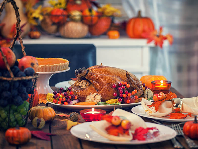 Table with thanksgiving foods and decorations