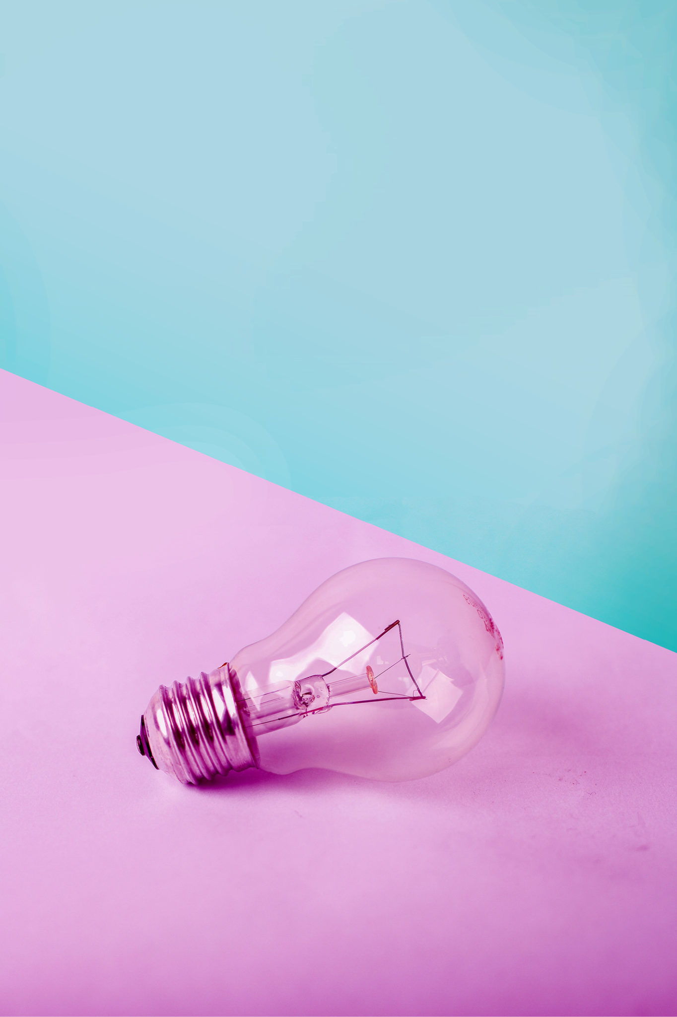 lightbulb on pink and blue wall