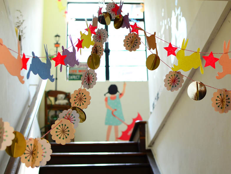 Paper crafts hanging above steps