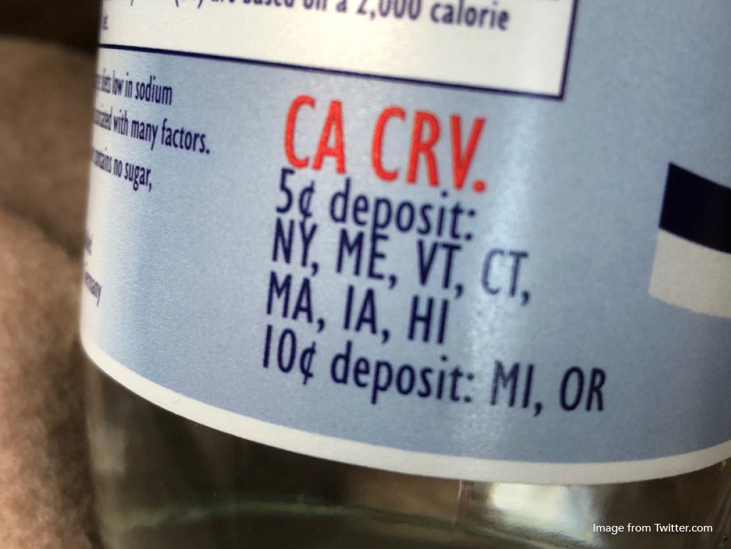 Deposit label on glass bottle