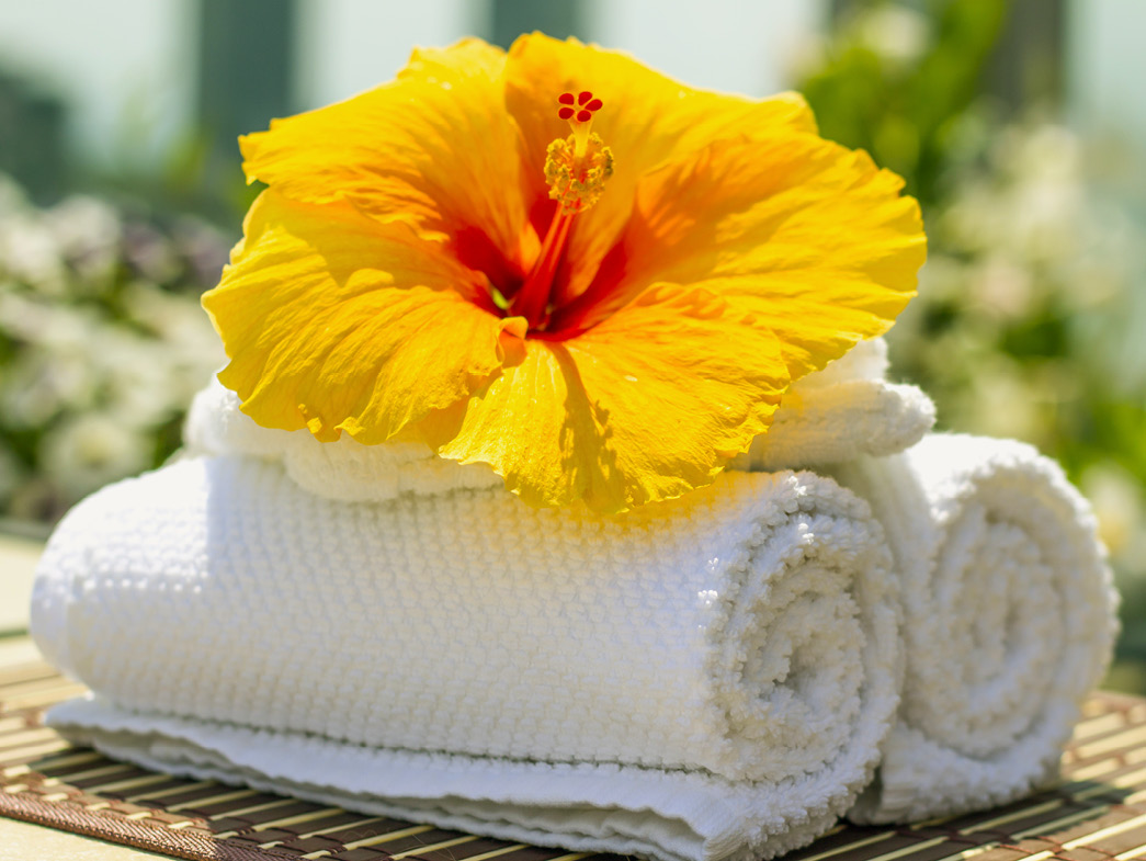 Towels with large yellow flower on top