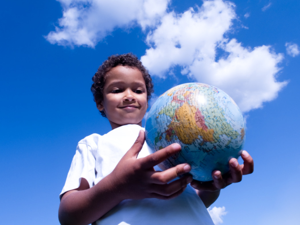 Child holding globe