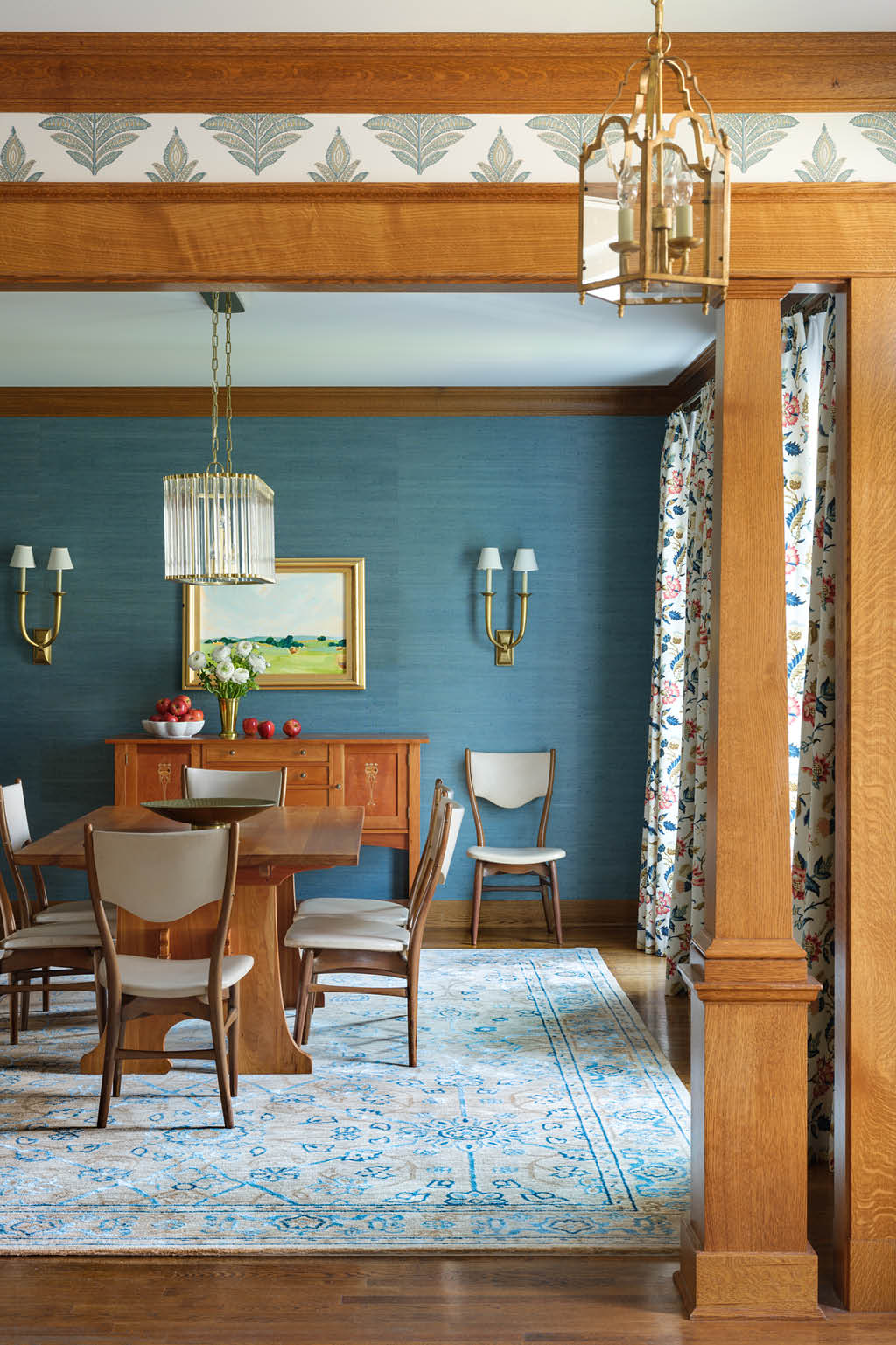 blue dining room with light wood trim