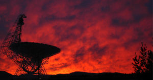 Green Bank telescope in front of colorful sunset