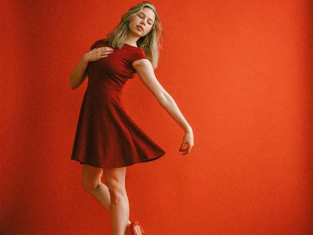 woman dancing in red dress