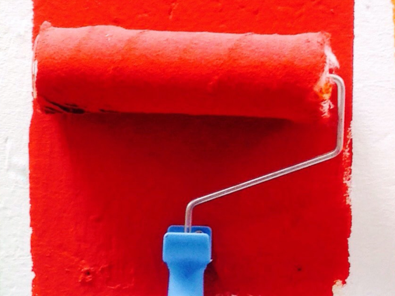 paint roller with red paint