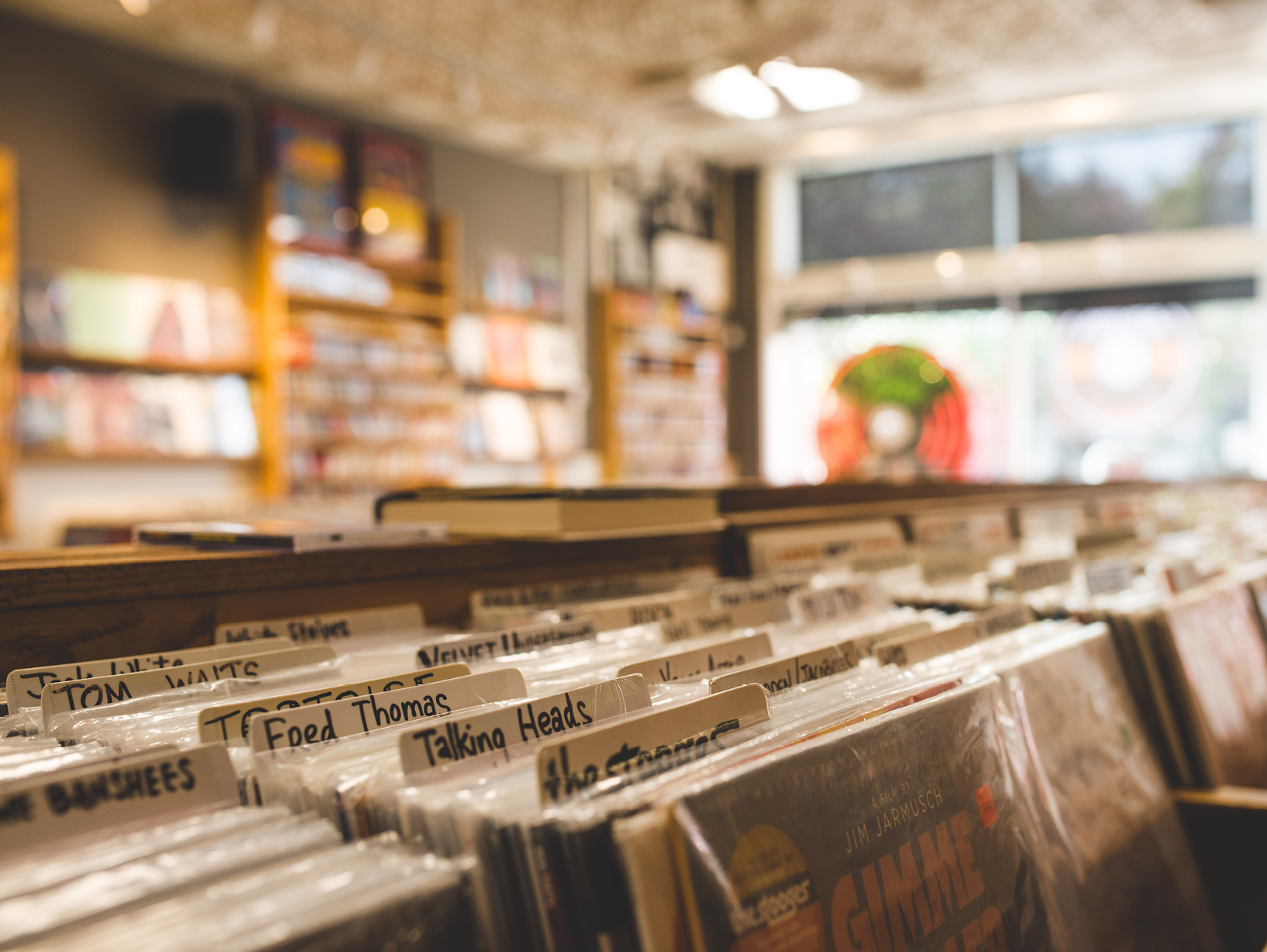 rows of vinyl at a record store