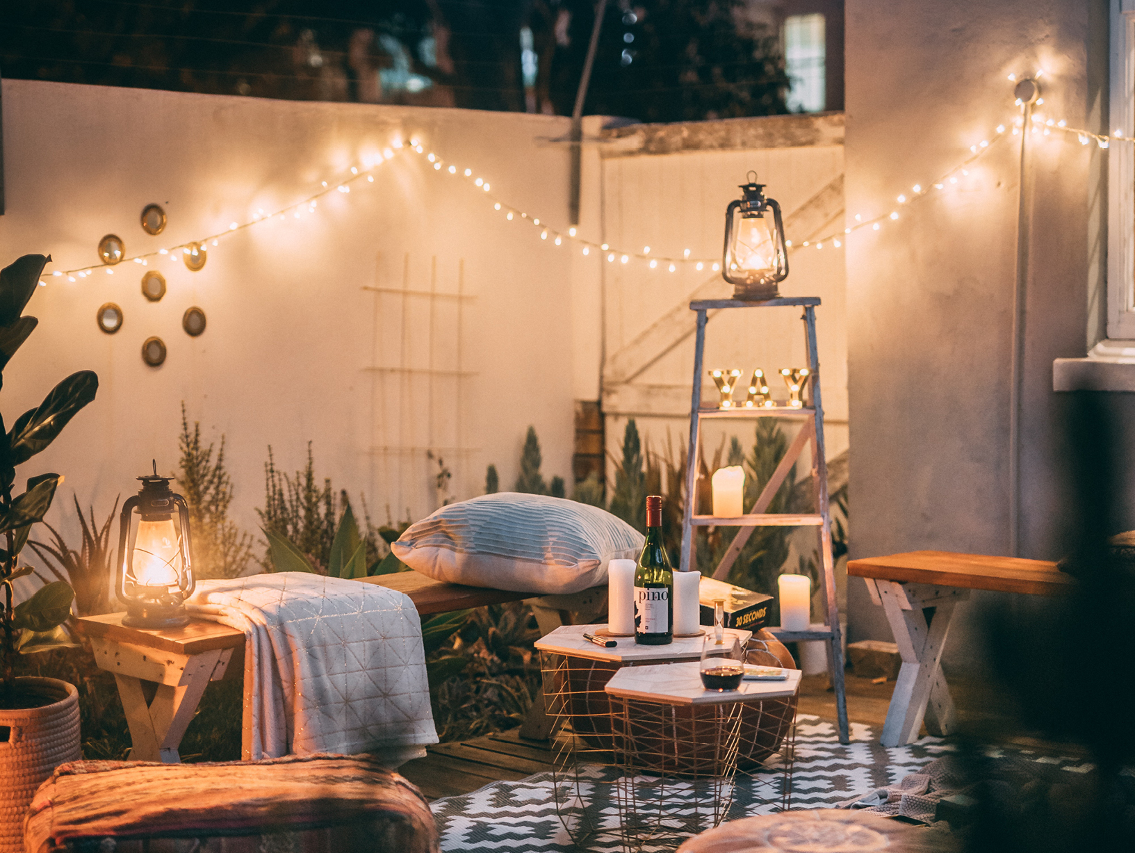 decorated backyard with furniture and lights