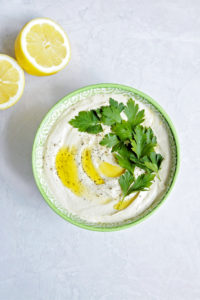 hummus in green bowl