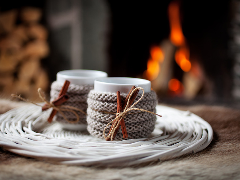 candles wrapped in burlap with cinnamon sticks