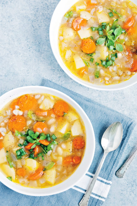 white bean soup in white bowl