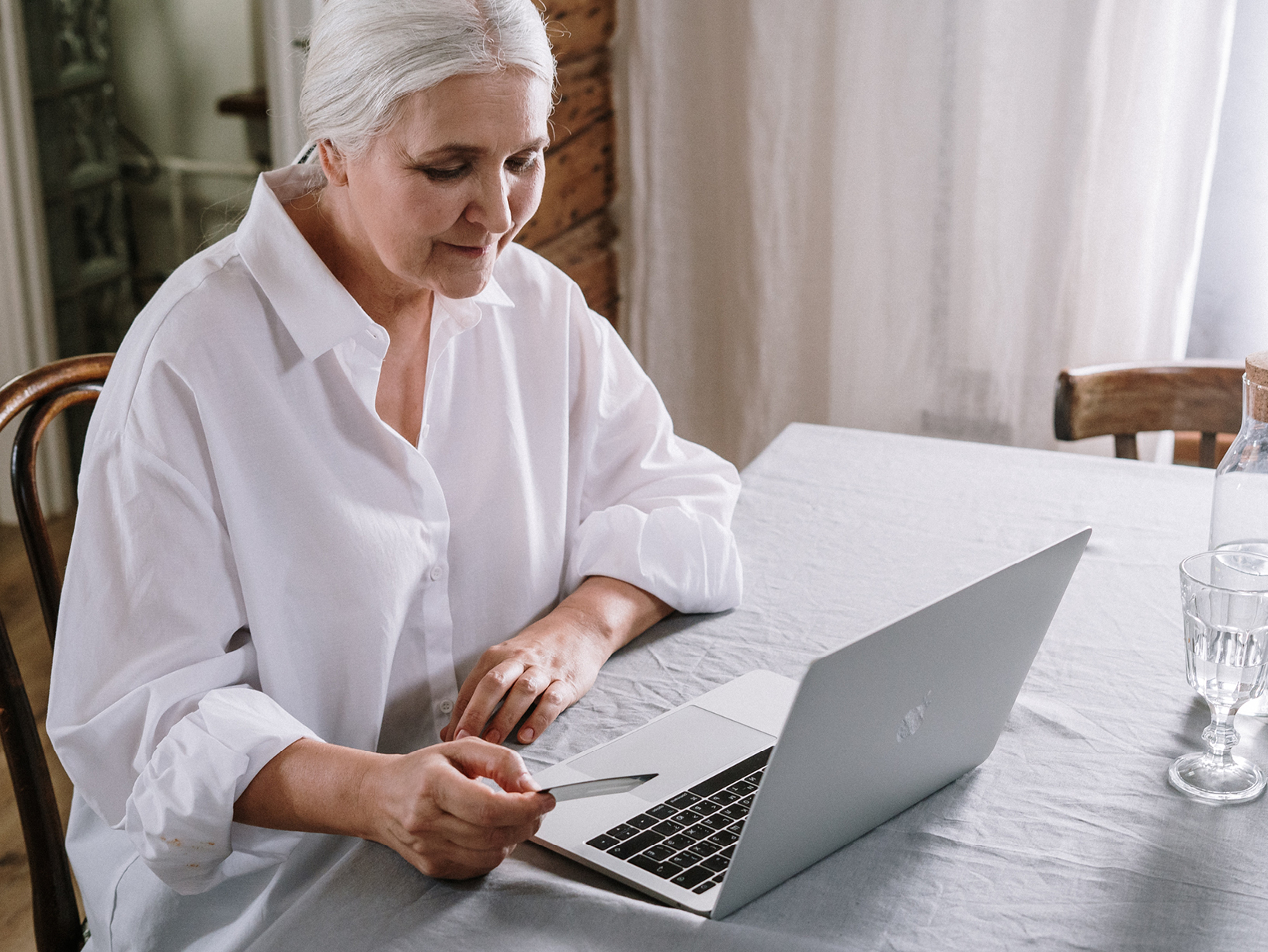 older woman sitting at laptop