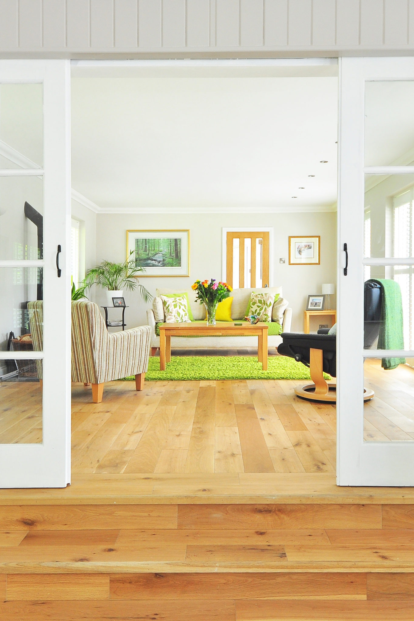 living room with french doors and light hardwood