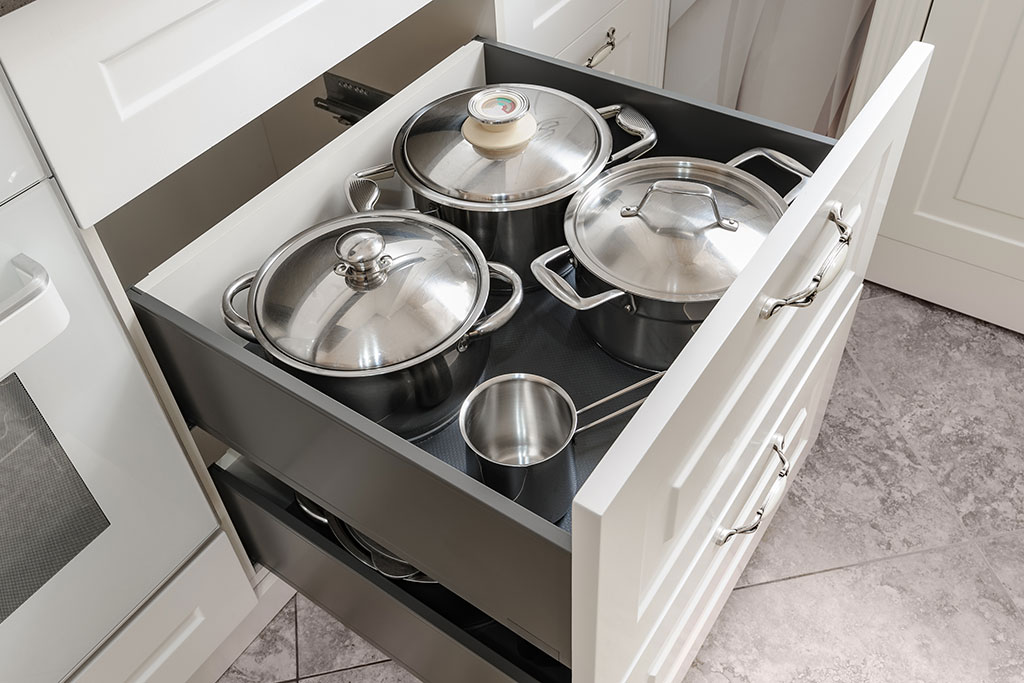 Pots and pans in cabinet