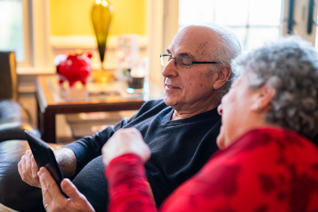 Older couple looking at iPad