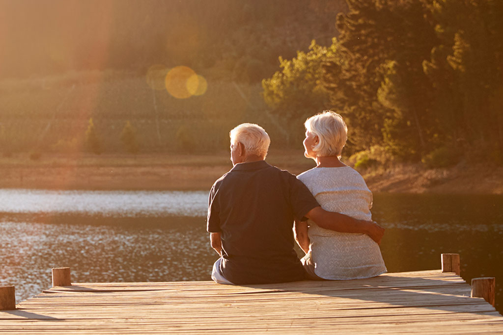 Lifestyle Older couple sitting together on dock