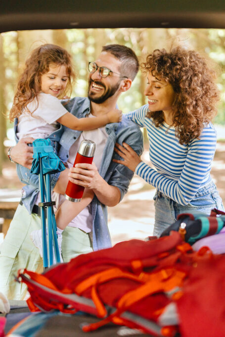 Couple with packed car for road trip